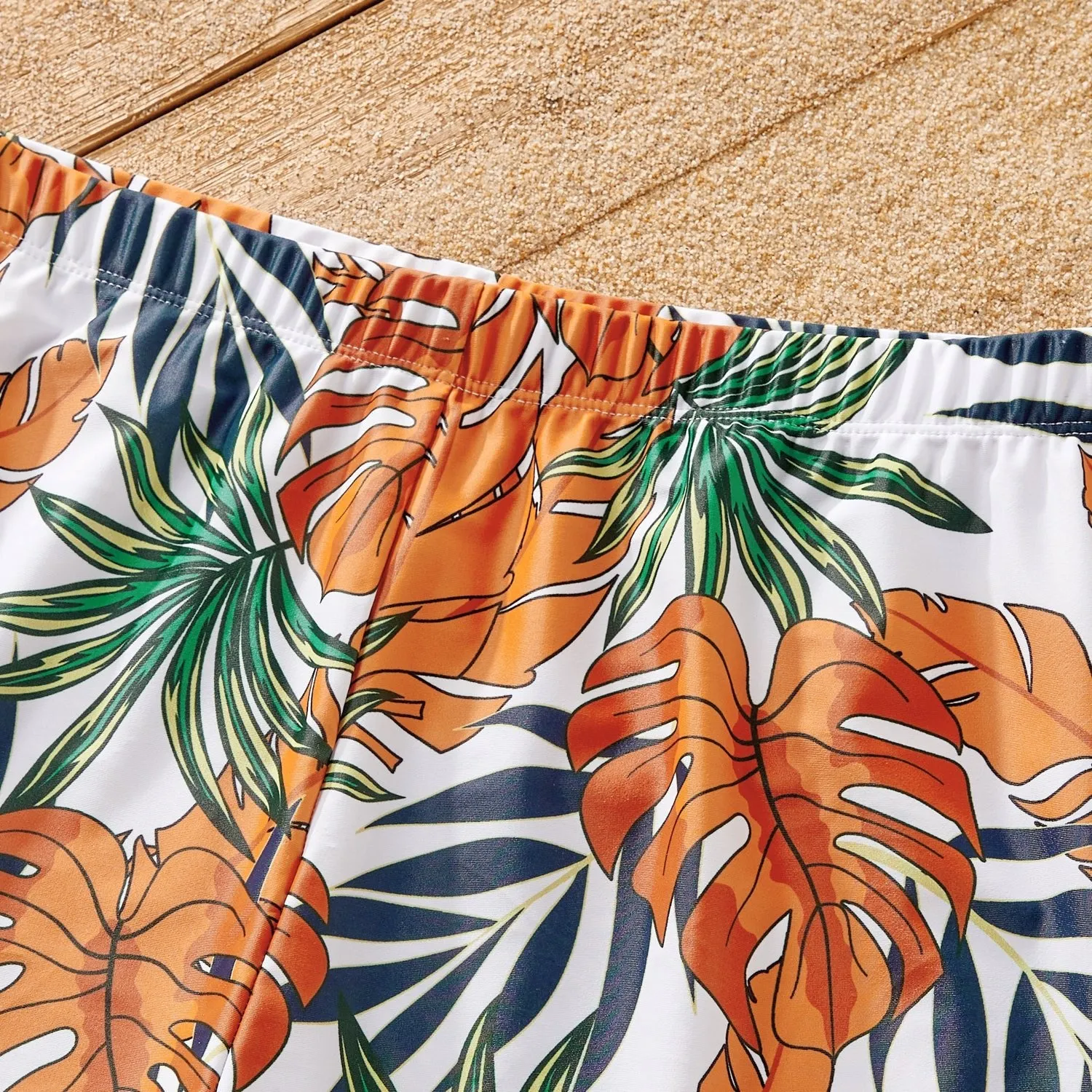 Family Matching Orange and All Over Tropical Plant Print Splicing Ruffle One-Piece Swimsuit and Swim Trunks Shorts